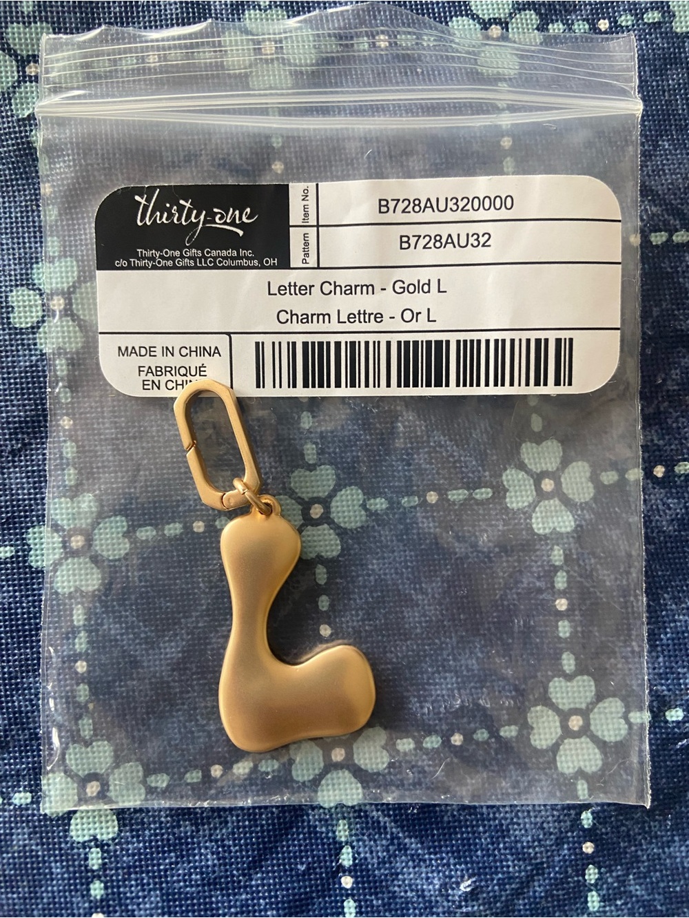Thirty-one letter charm “L”